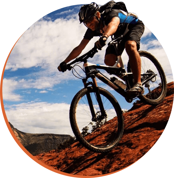 Person riding bike on hilly road