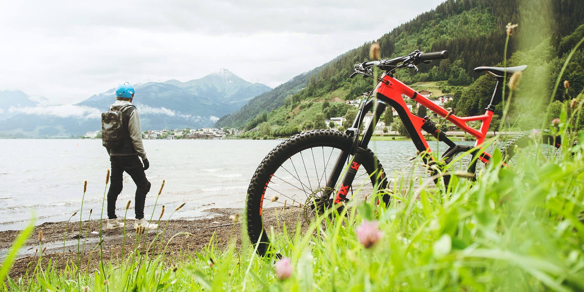 View of a man with bike standing near beach